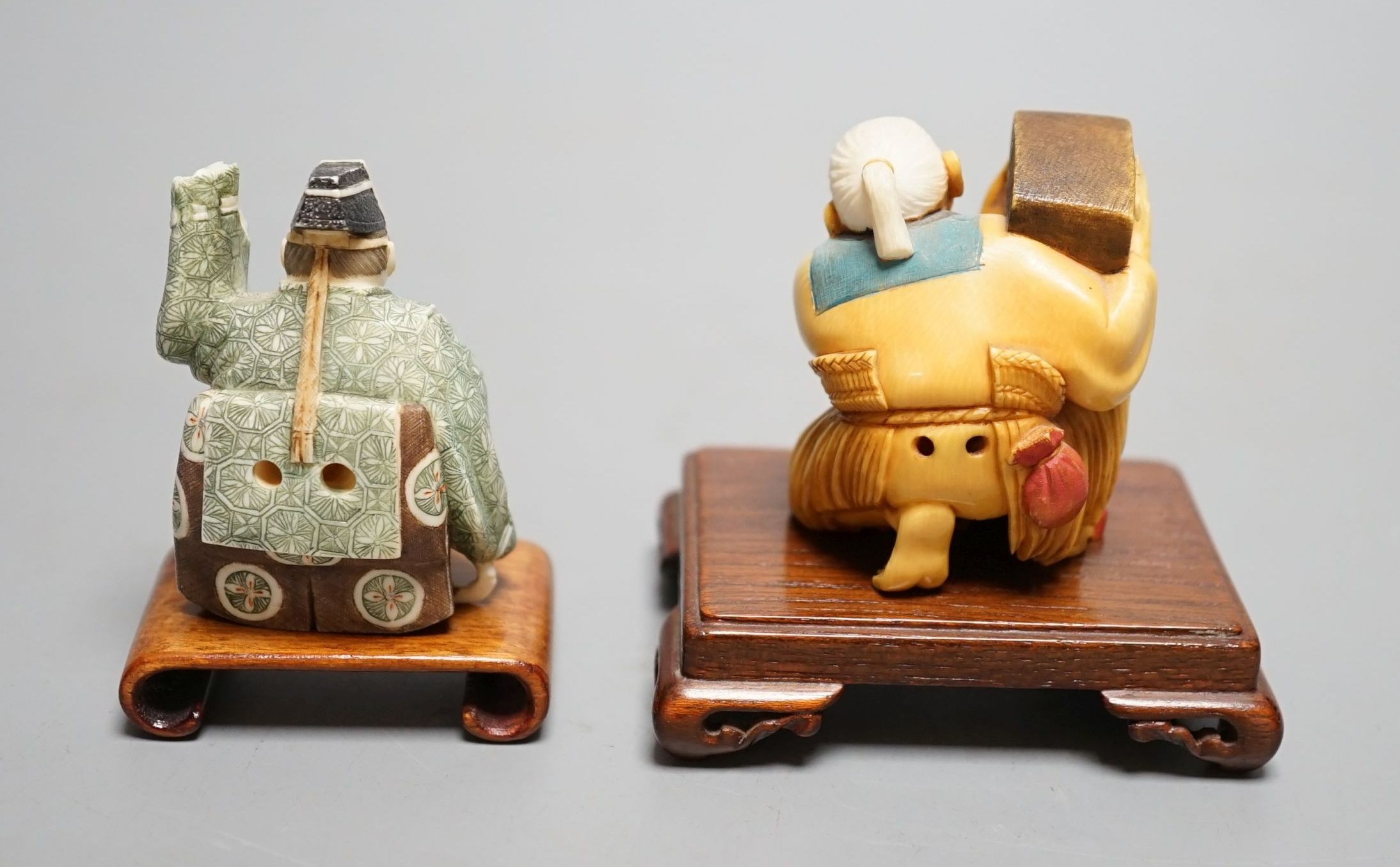 Two Japanese stained ivory okimono-netsuke of a priest and a man with a box, Taisho/early Showa period, signed - 6cm tall